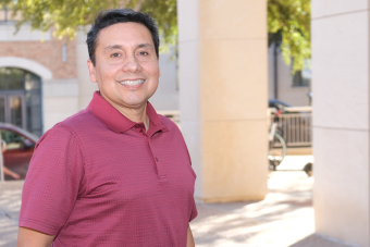 Headshot of Staff Merit Award Winner Bob Vargas outside on a sunny day