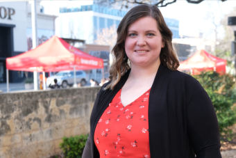 Headshot of Staff Merit Award Winner Paige Muehlenkamp-McHorse taken on the west side of campus