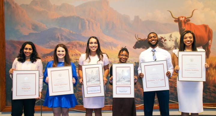 Photo of Outstanding Student Award Winners for 2021-22 holding framed certificates