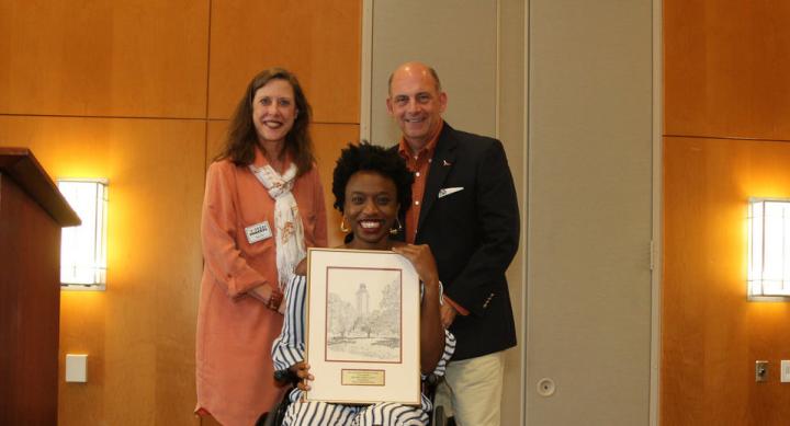Amie Jean holding her Mike Wacker plaque with Texas Parents Co-chairs